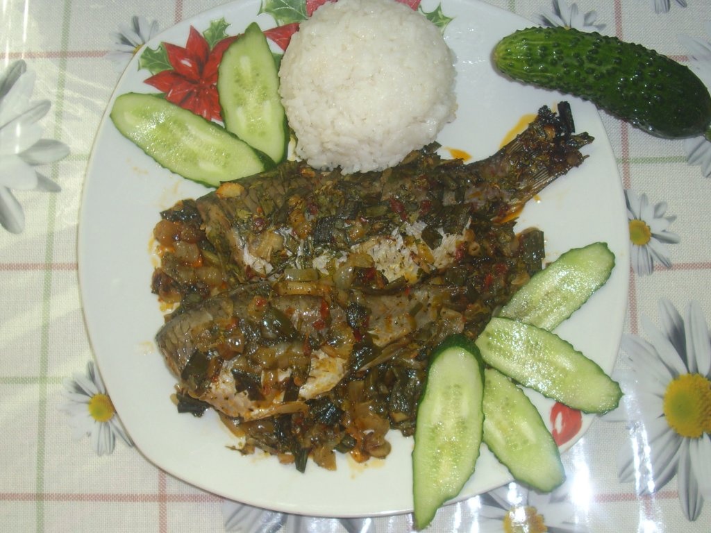 Peste la cuptor cu garnitura de orez