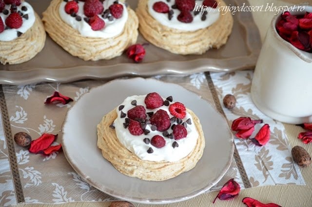 Raspberry & hazelnut meringue nests