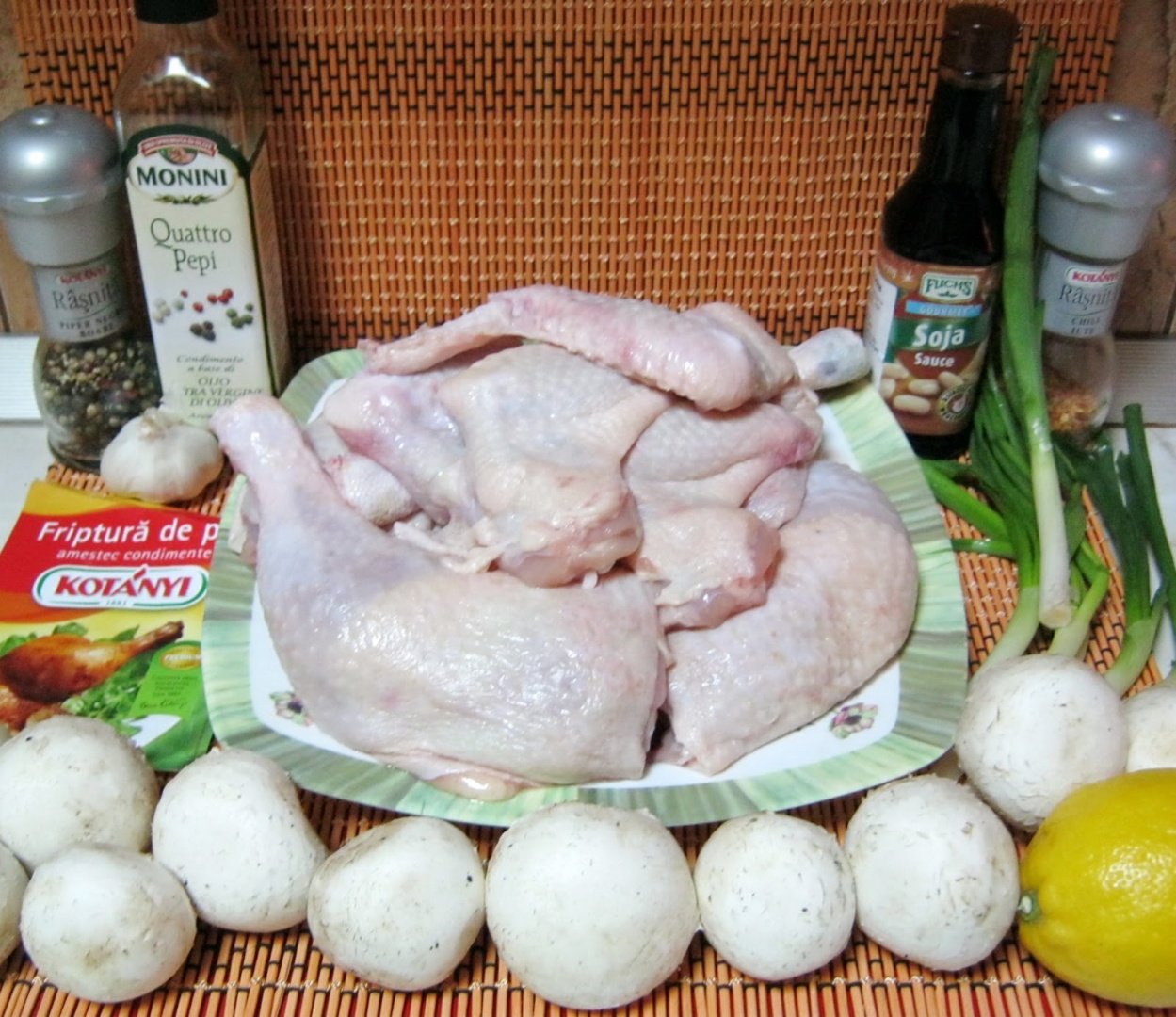 Aripioare si pulpe de pui pe pat de lamaie cu sos de usturoi si ciuperci