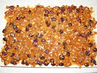 Napolitane cu nuca,stafide,rahat,merisoare ,glazurate cu crema de cacao